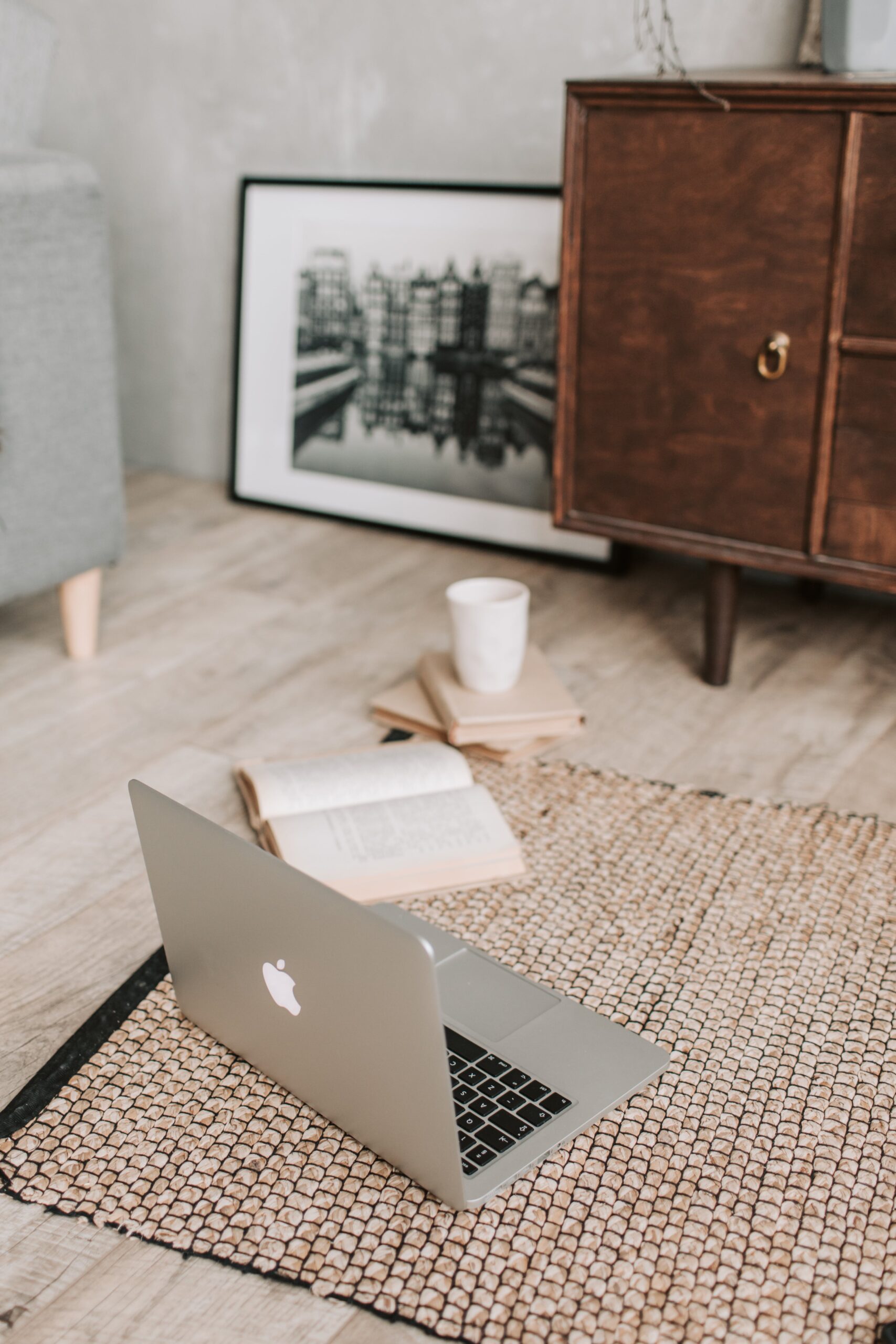 aesthetic room with neutral colors and laptop on floor, working from home